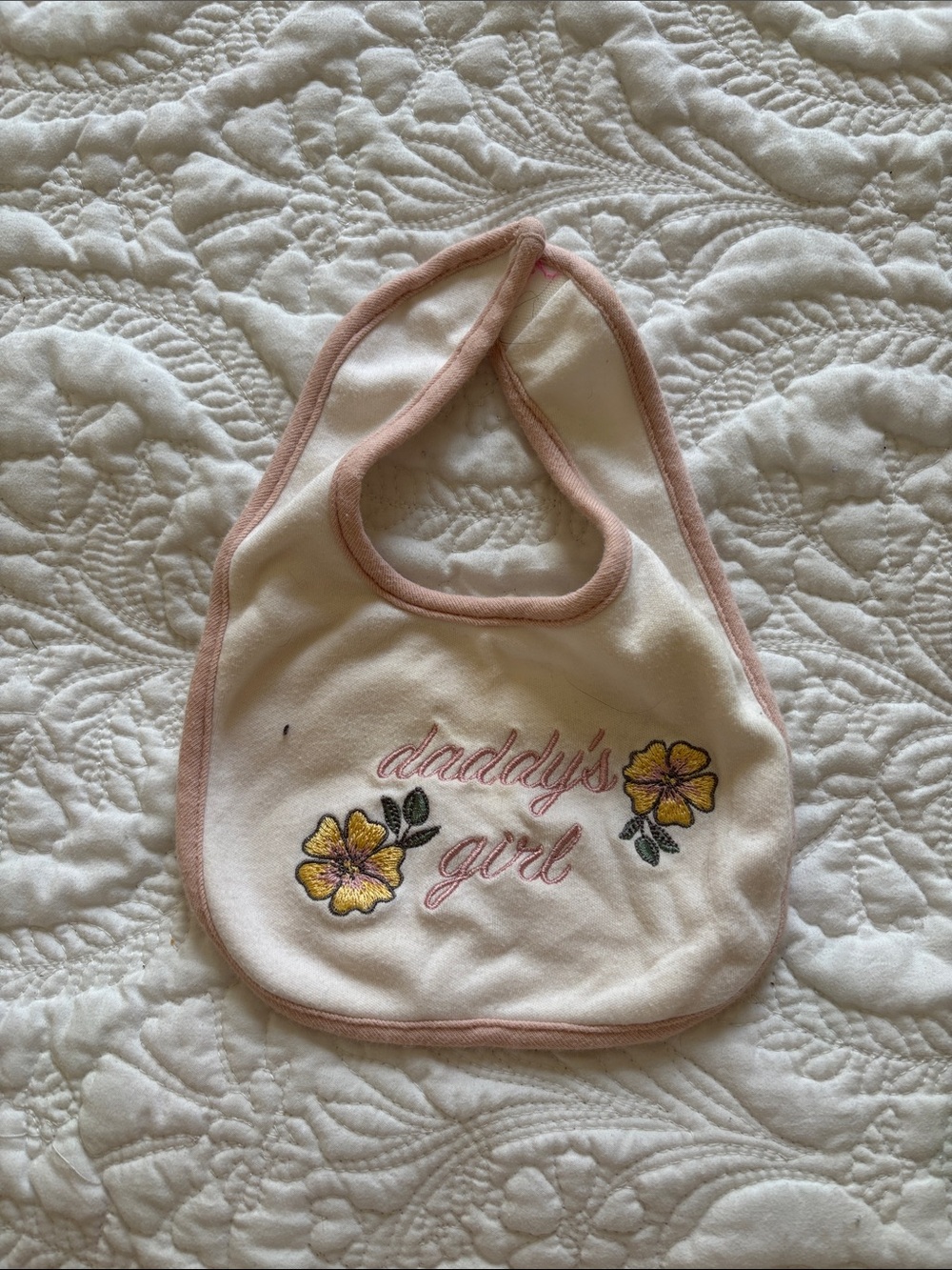 chick pea Cream Bib with Pink Trim and Yellow Floral Embroidery